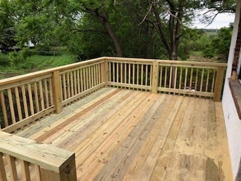 Elevated wooden deck with matching railing